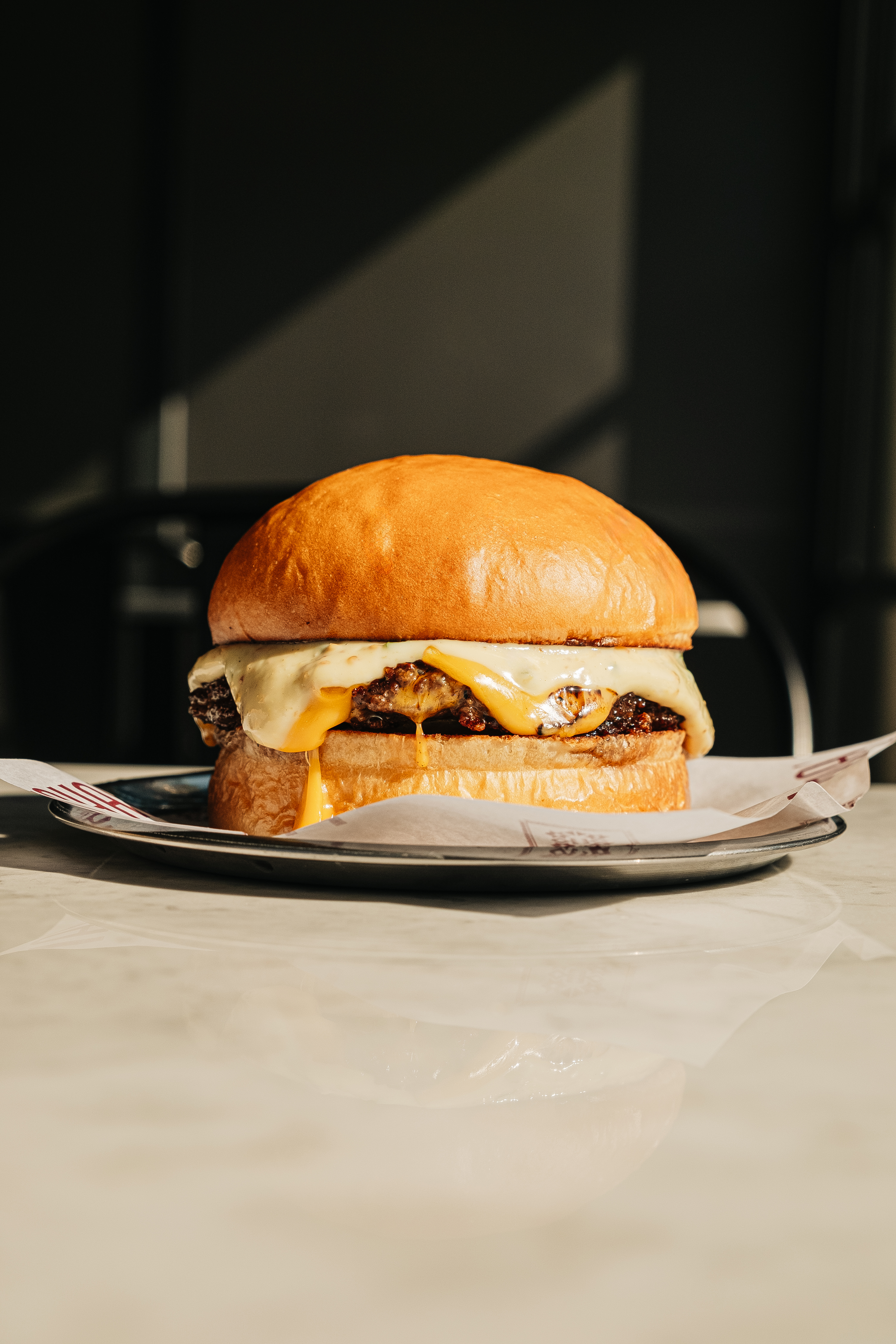 A crafted Mahalle Burger in an editorial setting