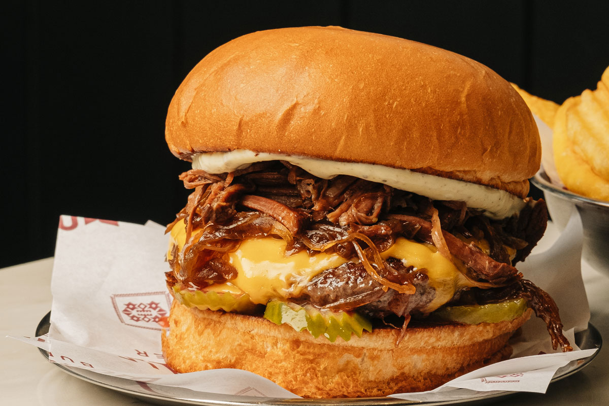 Supreme burger with slow-cooked rib and a smashed beef patty