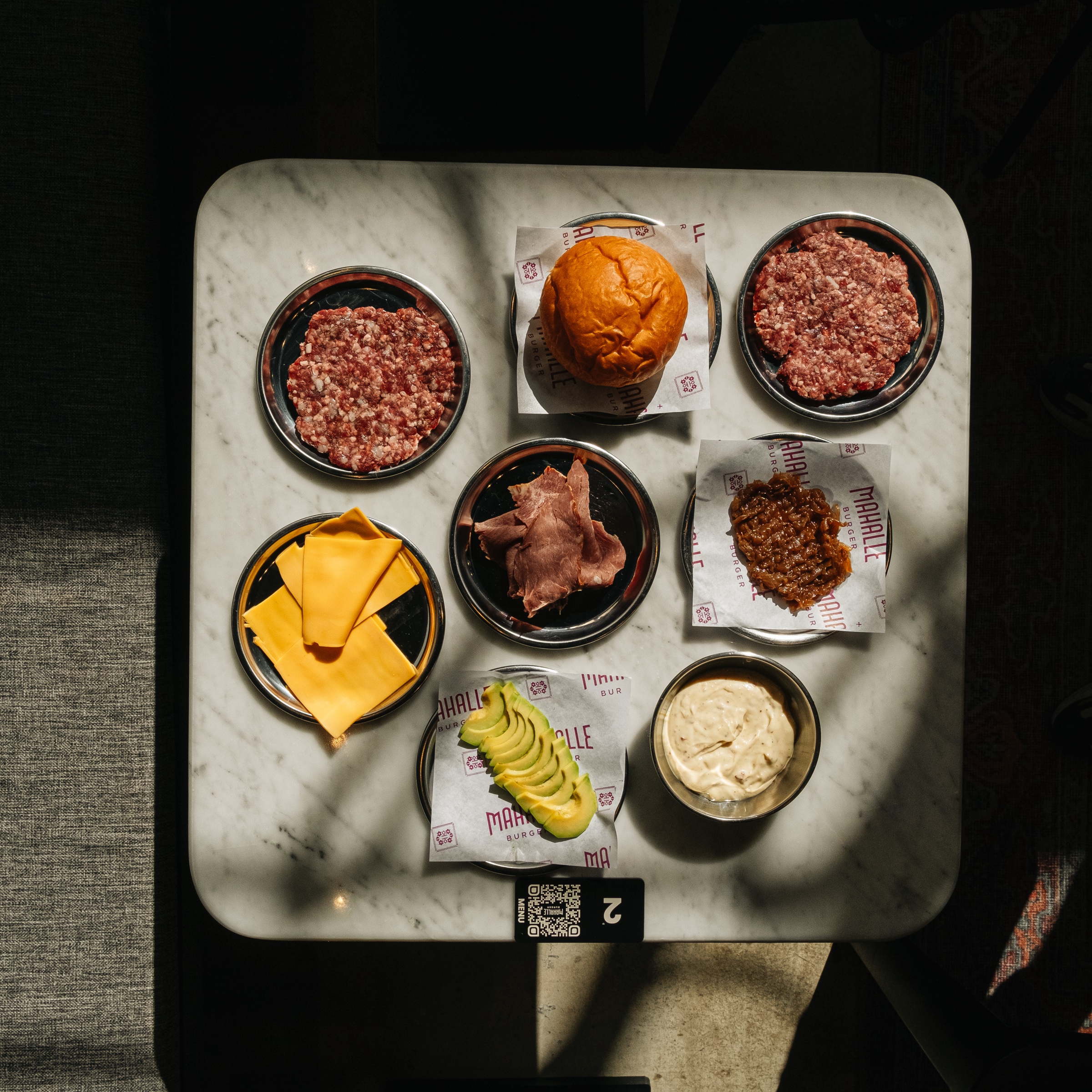 Fresh Mahalle Burger ingredients arranged for preparation